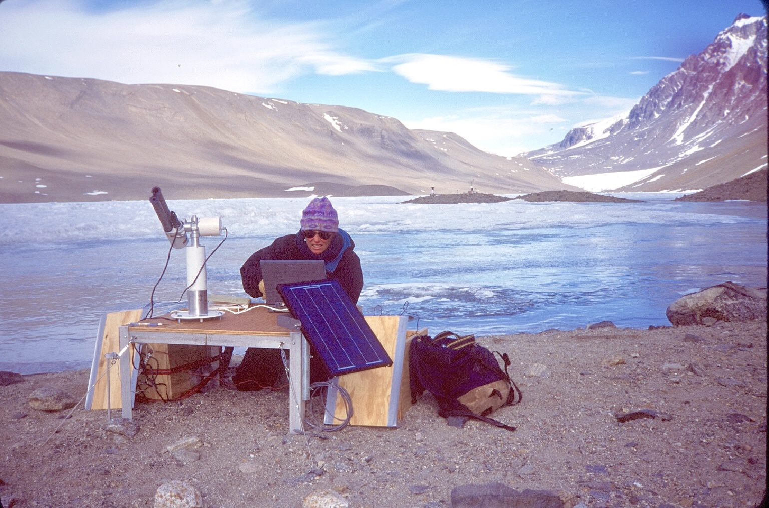 Me taking sun photometer measurements at edge of Lake Hoare 